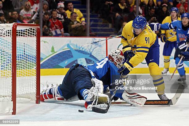 Loui Eriksson of Sweden scores a goal in the second period against Miikka Kiprusoff of Finland during the ice hockey men's preliminary game on day 10...