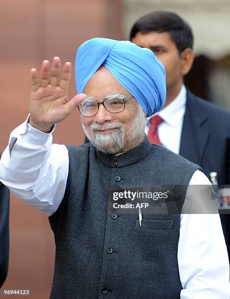 Indian Prime Minister Manmohan Singh waves as he arrives for the budget session of Parliament in New Delhi on February 22, 2010. Singh said all...