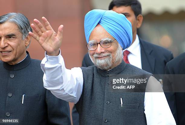 Indian Prime Minister Manmohan Singh waves as he arrives for the budget session of Parliament in New Delhi on February 22, 2010. Singh said all...