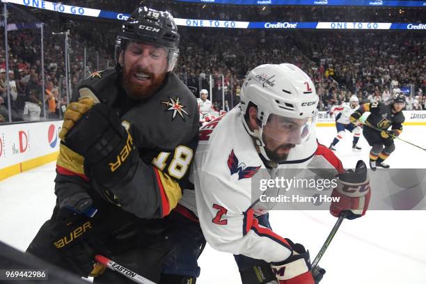 James Neal of the Vegas Golden Knights is checked into the boards by Matt Niskanen of the Washington Capitals during the third period in Game Five of...