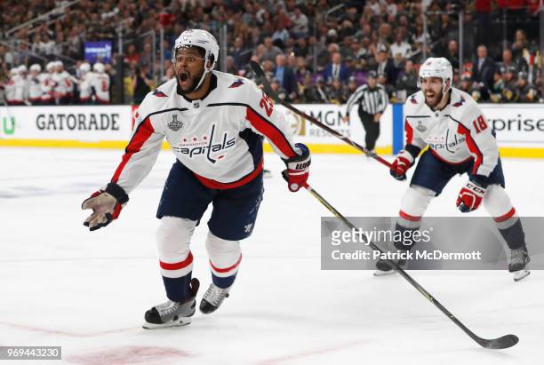 Devante Smith-Pelly of the Washington Capitals celebrates his goal to tie the game with teammate Chandler Stephenson during the third period of Game...