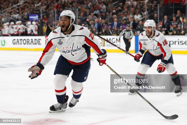 Devante Smith-Pelly of the Washington Capitals celebrates his goal to tie the game with teammate Chandler Stephenson during the third period of Game...