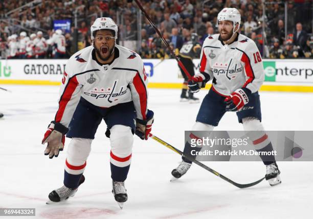 Devante Smith-Pelly of the Washington Capitals celebrates his goal to tie the game with teammate Chandler Stephenson during the third period of Game...