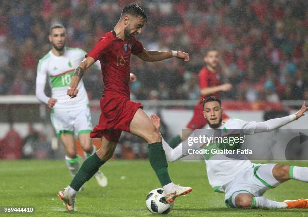 Portugal and Sporting CP midfielder Bruno Fernandes with Algeria and Rennes defender Rami Benssebaini in action during the International Friendly...