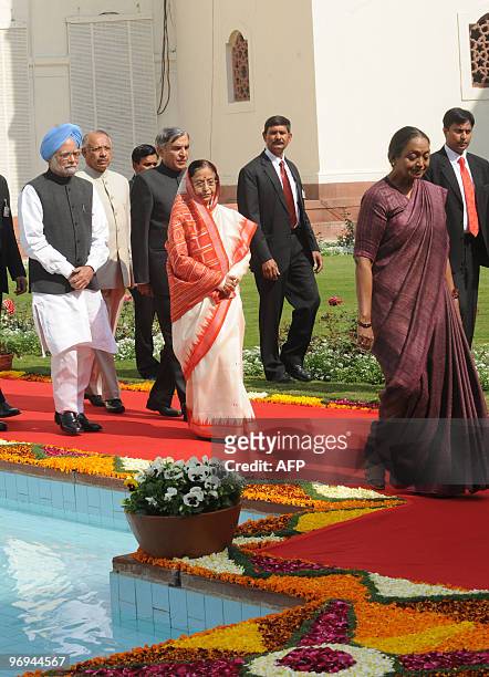 Indian President Pratibha Patil , Prime Minister Manmohan Singh , and Parliament Speaker Meira Kumar arrive for the opening of the budget session of...