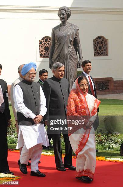 Indian President Pratibha Patil and Prime Minister Manmohan Singh arrive for the opening of the budget session of the Indian Parliament in New Delhi...