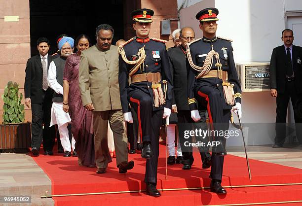 Presidential guards escort Indian Prime Minister Manmohan Singh and Parliament speaker Meira Kumar along with other ministers as they arrive for the...