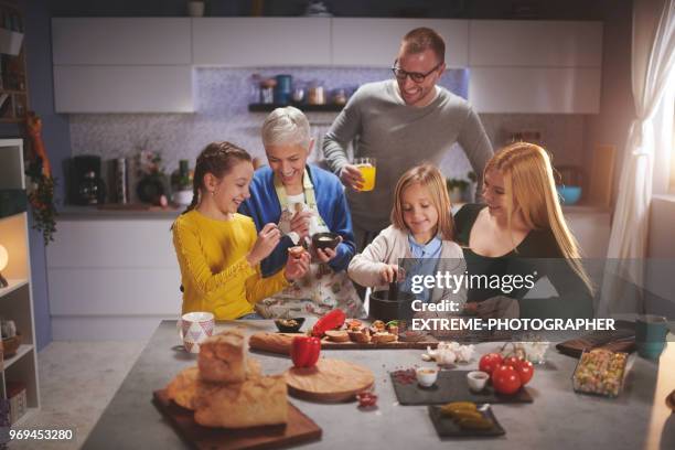 family in the kitchen - extreme dieting stock pictures, royalty-free photos & images