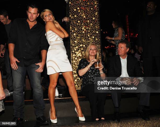 Doug Reinhardt, Paris Hilton, Kathy Hilton and Rick Hilton attend TAO Nightclub at the Venetian on February 20, 2010 in Las Vegas, Nevada.