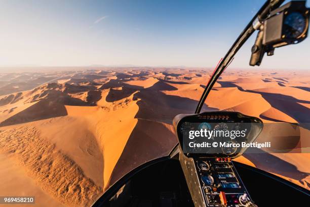 sossusvlei sand dunes seen from helicopter cockpit, namibia - helicopter window stock pictures, royalty-free photos & images