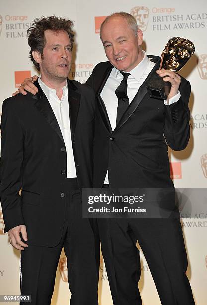 Citation reader Tom Hollander poses with Barry Ackroyd as he receives the award for Best Cinematography for The Hurt Locker during the Orange British...