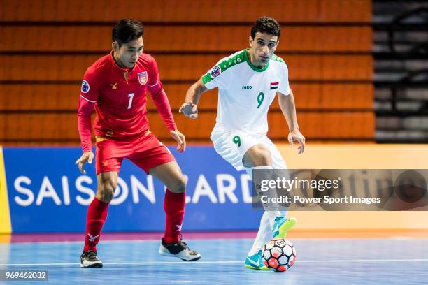 Hasan Ali Jabbar of Iraq fights for the ball with Myo Myint Soe of Myanmar during the AFC Futsal Championship Chinese Taipei 2018 Group Stage match...