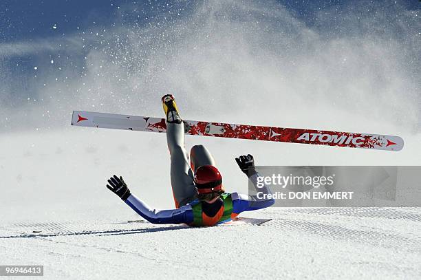 Finland's Janne Ahonen falls after landing in the Ski Jumping LH Individual trial at Whistler Olympic Park on February 20, 2010 during the Vancouver...