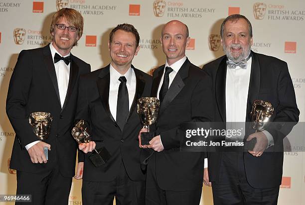 Joe Letteri, Stephen Rosenbaum, Richard Banehan and Andrew Jones pose with their best visual effects award in front of the winners boards during the...