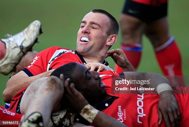 Chris Latham and MIles Benjamin lie together in a pile during the Guinness Premiership match between Bath and Worcester at the Recreation Ground on...