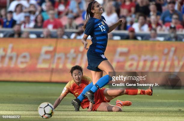 Wu Haiyan of China defends against Alex Morgan of the United States in the first half of an international friendly soccer match at Rio Tinto Stadium...