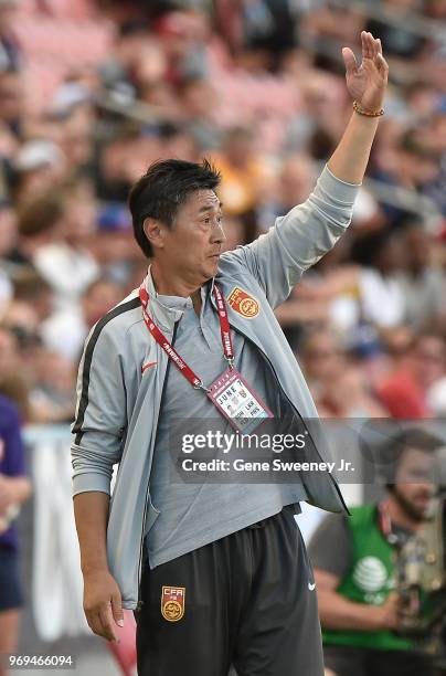 Head coach Jia Xiuquan of China gestures from the sideline in the first half of an international friendly soccer match against the United States at...