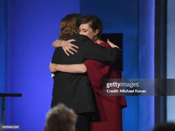 Bob Gazzale hugs Rachel Morrison onstage at the American Film Institute's 46th Life Achievement Award Gala Tribute to George Clooney at Dolby Theatre...