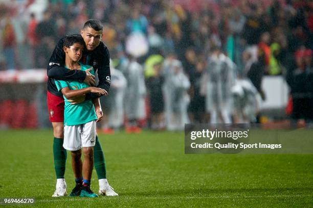 Cristiano Ronaldo of Portugal plays with his son after the friendly match of preparation for FIFA 2018 World Cup between Portugal and Algeria at the...