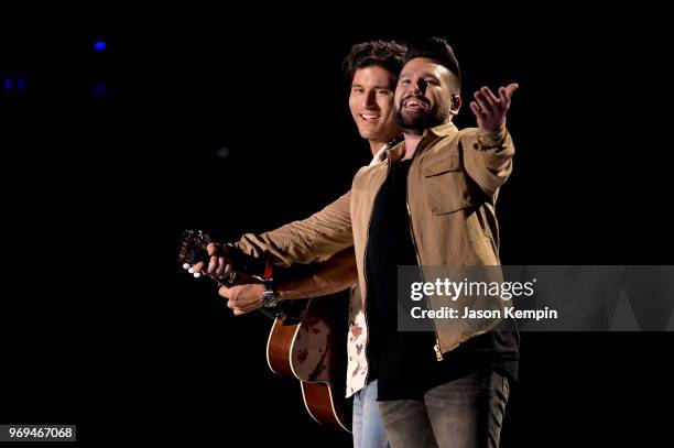 Dan Smyers and Shay Mooney of musical duo Dan + Shay perform onstage during the 2018 CMA Music festival at the Nissan Stadium on June 7, 2018 in...