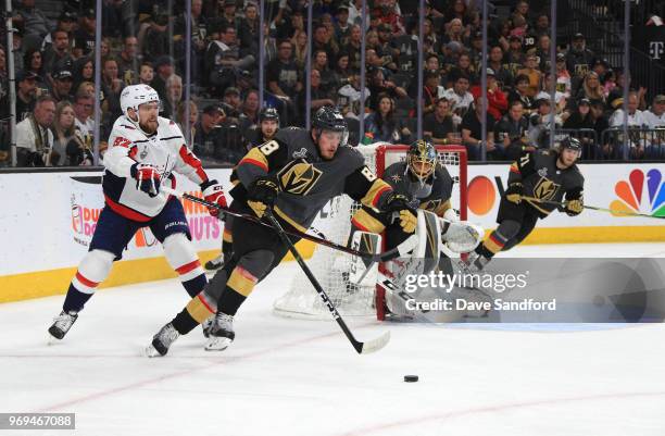 Nate Schmidt of the Vegas Golden Knights starts the break out play away from Evgeny Kuznetsov of the Washington Capitals in the third period of Game...