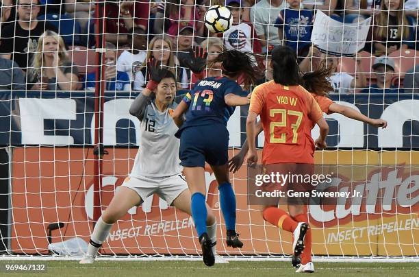 Alex Morgan of the United States scores as her header gets past goalkeeper Peng Shimeng of China in the second half of an international friendly...