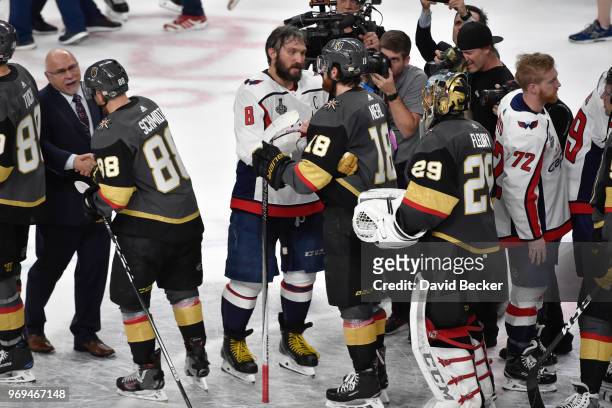 James Neal and Marc-Andre Fleury of the Vegas Golden Knights congratulate Alex Ovechkin of the Washington Capitals on winning the Stanley Cup...