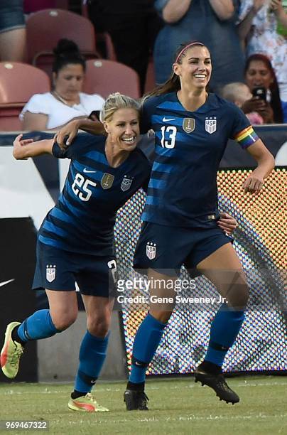 McCall Zerboni of the United States celebrates with teammate Alex Morgan after Morgan's goal in the second half of an international friendly soccer...