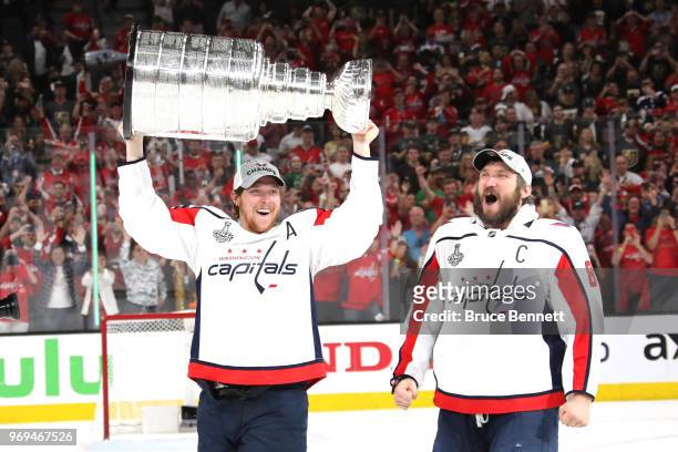 Alex Ovechkin hands of the Stanley Cup to Nicklas Backstrom of the Washington Capitals after their team's 4-3 win over the the Vegas Golden Knights...
