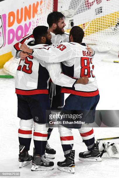 Andre Burakovsky, Tom Wilson and Jay Beagle of the Washington Capitals celebrate their 4-3 win over the Vegas Golden Knights to win the Stanley Cup...
