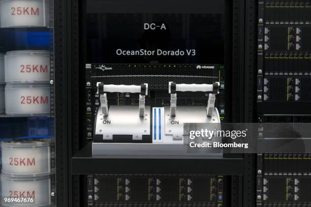 Handle bars are seen on Huawei Technologies Co.'s OceanStor Dorado V3 All-Flash Storage System on display in an exhibition hall at the company's...