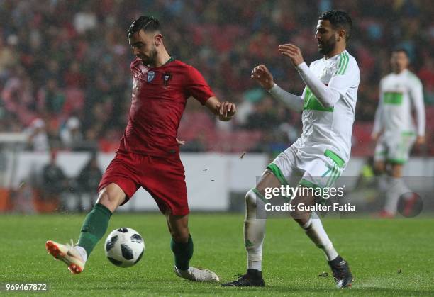 Portugal and Sporting CP midfielder Bruno Fernandes with Algeria and Leicester City FC forward Riyad Mahrez in action during the International...