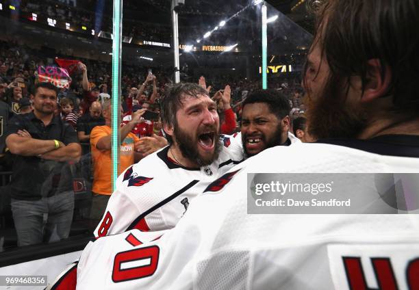 Alex Ovechkin of the Washington Capitals celebrates winning the Stanley Cup with teammates goaltender Devante Smith-Pelly and Braden Holtby after...