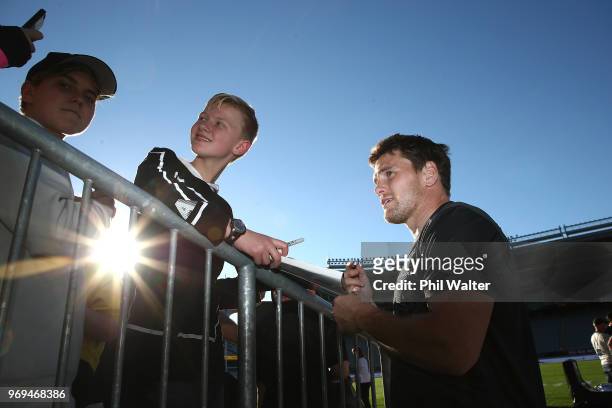 Matt Todd of the All Blacks signs autographs during the New Zealand All Blacks Captain's Run at Eden Park on June 8, 2018 in Auckland, New Zealand.