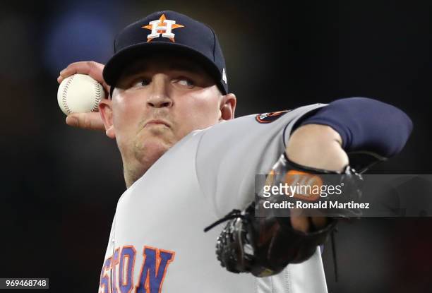 Will Harris of the Houston Astros throws against the Texas Rangers in the seventh inning at Globe Life Park in Arlington on June 7, 2018 in...