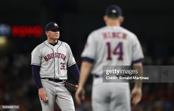 Will Harris of the Houston Astros leaves the game against the Texas Rangers in the seventh inning at Globe Life Park in Arlington on June 7, 2018 in...