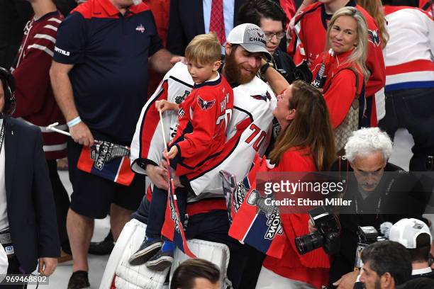 Braden Holtby of the Washington Capitals celebrates with his son Benjamin Holtby after the Capitals' win over the Vegas Golden Knights in Game Five...