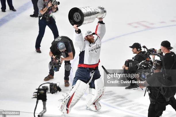 Braden Holtby of the Washington Capitals celebrates with the Stanley Cup after defeating the Vegas Golden Knights in Game Five of the Stanley Cup...