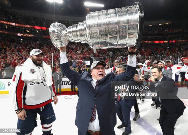 Head coach Barry Trotz of the Washington Capitals celebrates with the Stanley Cup after his team defeated the Vegas Golden Knights 4-3 in Game Five...