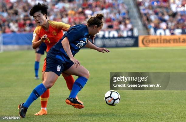 Savannah McCaskill of the United States gets past defender Ren Guixin of China in the first half of an international friendly soccer match at Rio...