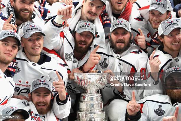 The Washington Capitals celebrate with the Stanley Cup after they defeated the Vegas Golden Knights 4-3 in Game Five of the 2018 NHL Stanley Cup...