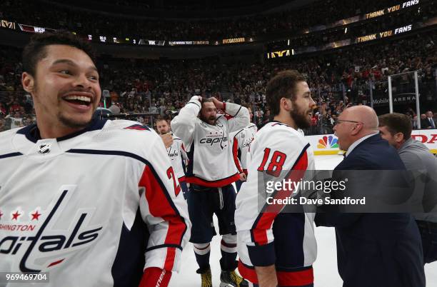 Madison Bowey, Alex Ovechkin, Chandler Stephenson and Barry Trotz of the Washington Capitals celebrate after Game Five of the 2018 NHL Stanley Cup...