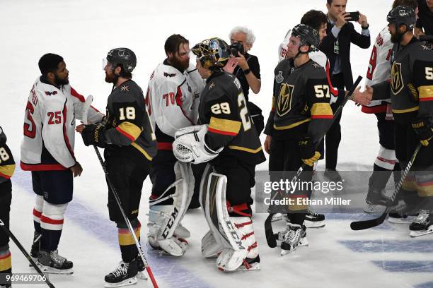 Braden Holtby of the Washington Capitals and Marc-Andre Fleury of the Vegas Golden Knights shake hands after Game Five of the 2018 NHL Stanley Cup...