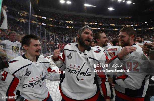 Dmitry Orlov, Alex Ovechkin, Matt Niskanen, Philipp Grubauer, Evgeny Kuznetsov and Tom Wilson of the Washington Capitals celebrate after Game Five of...