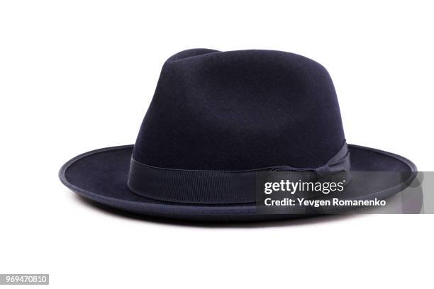 a classic low crown fedora hat in a dark blue color. isolated on white background. - white hat fashion item stockfoto's en -beelden