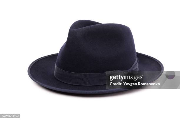 a classic low crown fedora hat in a dark blue color. isolated on white background. - sombrero fedora fotografías e imágenes de stock