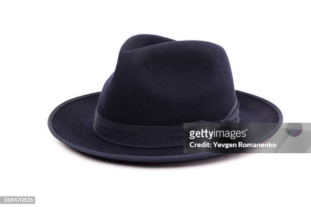 a classic low crown fedora hat in a dark blue color. isolated on white background. - white hat fashion item stockfoto's en -beelden