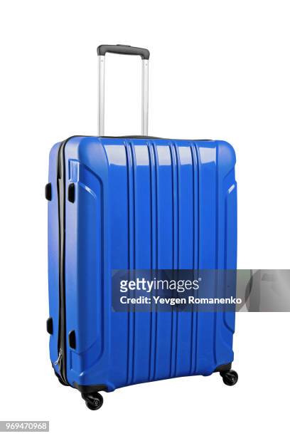 blue travel bag on wheels, isolated on white background. - white purse stock-fotos und bilder