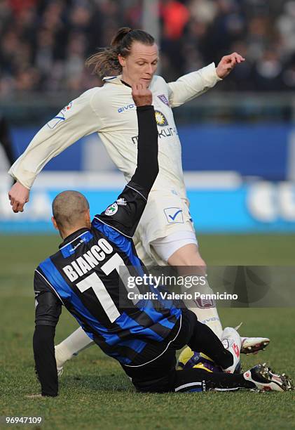 Paolo Bianco of Atalanta BC battles for the ball with Nicolas Frey of AC Chievo Verona during the Serie A match between Atalanta BC and AC Chievo...