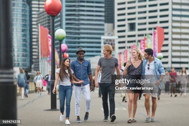 millennials young friends walking in city - australian tourism stock pictures, royalty-free photos & images